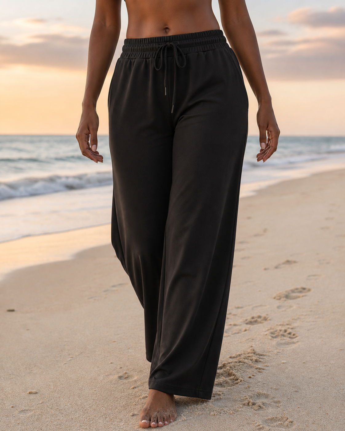 Black Athflow Pants worn on the beach