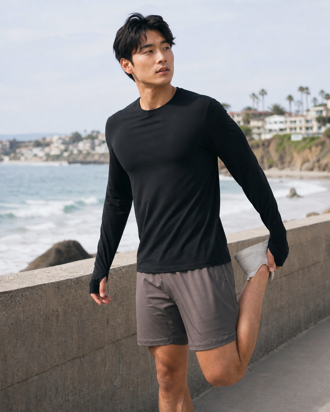 Black Thumbhole Long Sleeve Tee worn during a coastal stretch