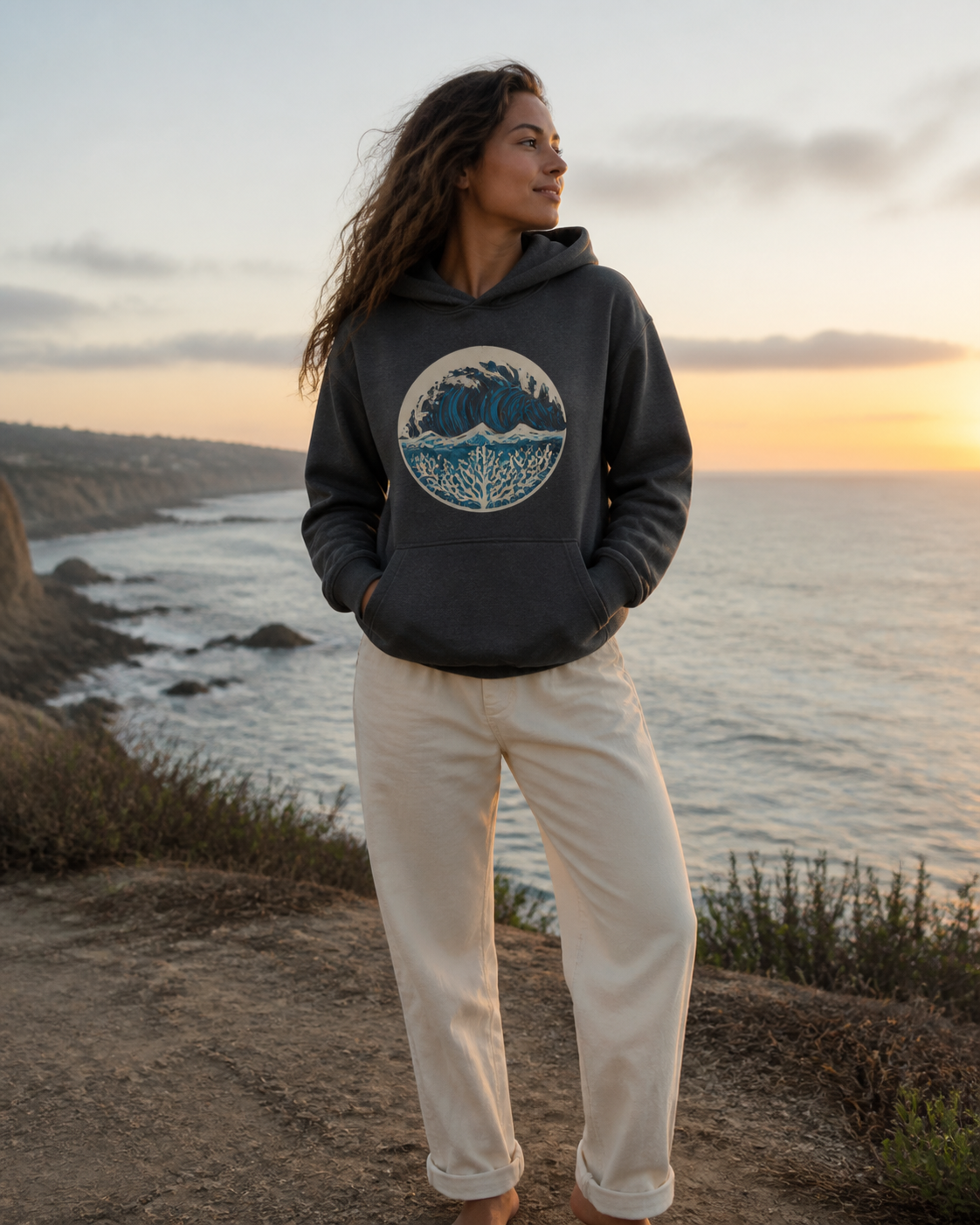 Woman wearing the KeAloha Charcoal Graphic Pullover Hoodie at sunset