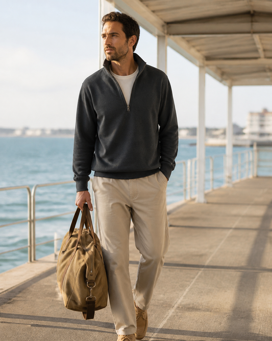 Man wearing the KeAloha Charcoal Half-Zip Pullover on a coastal pier