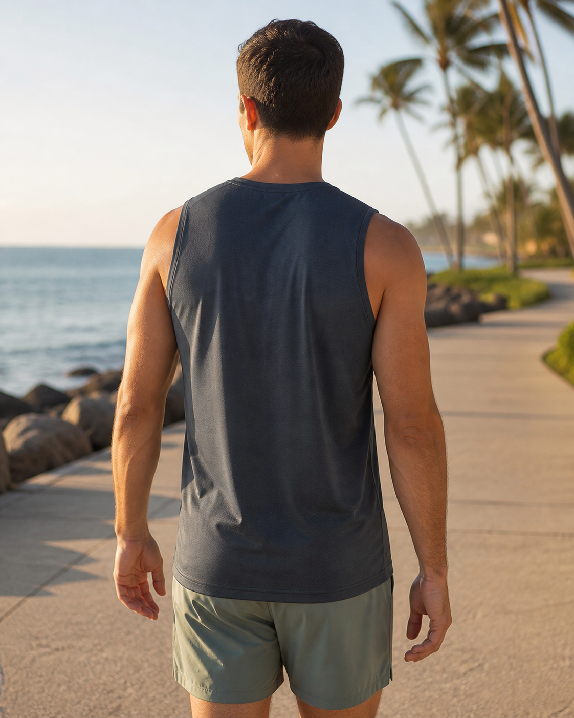 Charcoal recycled fitted running tank back view on a coastal path