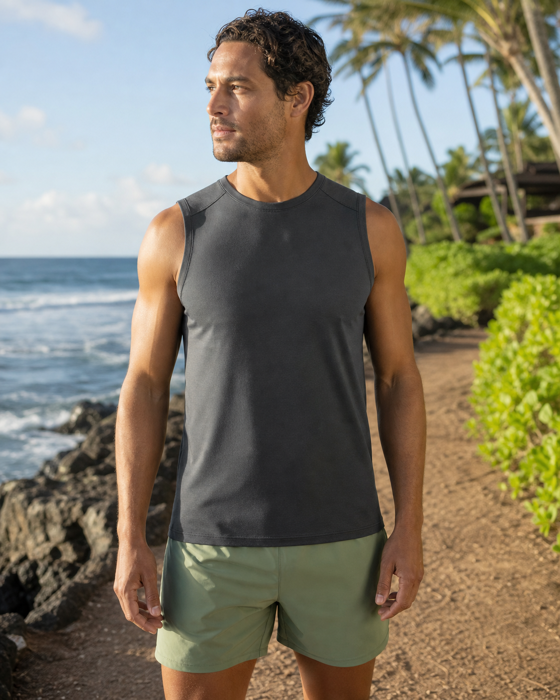 Charcoal recycled fitted running tank front view on a coastal path