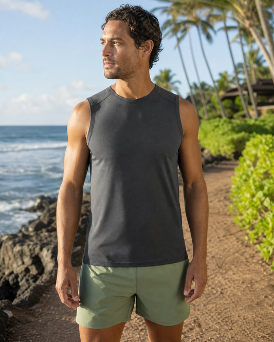 Charcoal recycled fitted running tank front view on a coastal path